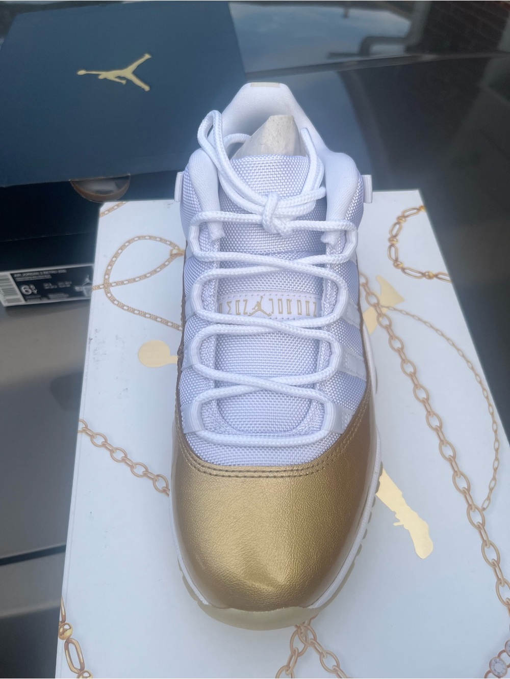 Jordan Women's Low-Top Sneaker in White and Gold